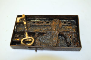 Shipwrecked door lock with a cast of the original key.