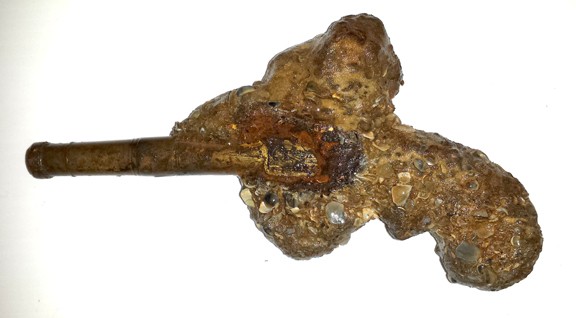 Pistol with some concretion removed.