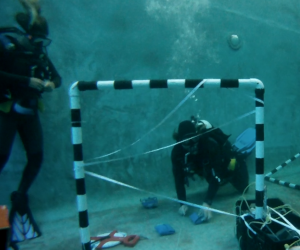 The black out mask obstacle course in the pool helps train divers to work calmly in poor visibility environments.