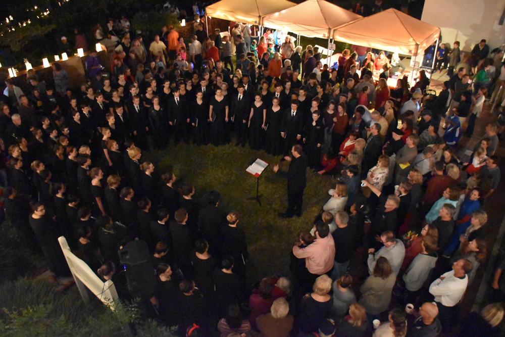 Performances at Luminary Night included the St. Augustine High School Choir, seen here under the direction of Mr. Jeff Dodd.