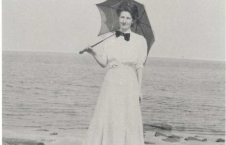 women holding umbrella on the beach